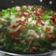 When onions start to brown, stir all the ingredients together