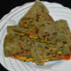Serve these pancakes hot with pickle or onion-yogurt raita. Enjoy this scrumptious meal!