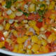 Step six: Garnish with roasted halved peanuts. Corn chaat is ready!