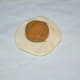 Step eight: Take an equally sized dough ball. Make a patty. Place a jaggery-coconut ball in the center.