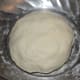 Step two: Knead, while adding water little by little, to get a smooth and pliable dough.
