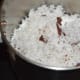 Step four: Pulse the grated coconut 1 or 2 times.