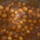 Step twelve: Open the lid once the pressure comes down. Add some chopped coriander leaves. Check for the taste and adjust accordingly. Remove and discard the bay leaf and other big whole spices. Transfer the curry into a serving dish.