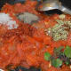 Step five: Add dried oregano, fresh basil leaves, pepper powder, red chili powder, and sugar. Mix the contents. Turn off the fire.