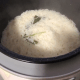 The fragrant coconut rice is cooked. Let the rice stays at warm setting in the rice cooker.
