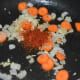 Step three: Add red chili flakes and stir.