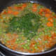Step six: Add chopped dill leaves. Mix well. Continue stir cooking for two more minutes.