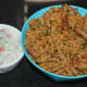Step ten: Serve hot spinach rice with cucumber-onion raita or any other yogurt-based raita. Happy eating!