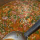 Step eight: Add 3 glasses of water. Adjust the salt. Cook the mix for 5 to 6 minutes while stirring often. Close the cooker lid. Place the weight. Cook up to 2 whistles and simmer for 5 minutes. Turn off the stove.