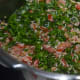 Mixing and cooking the spinach.