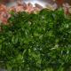 Step five: Add chopped spinach. Continue mixing and cooking for a while.