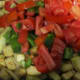 Add tomatoes and peppers to eggplant.