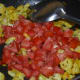 Step four: Add chopped tomatoes. Stir-cook till they become soft, not mushy.