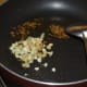 Step two: Saute cumin seeds in oil till they sizzle. Add chopped ginger and garlic. Saute till they become golden brown in color.