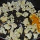 Step three: Throw in cauliflower cubes. Add some turmeric powder. Stir-cook for 4-5 minutes. Add some water to keep them moist.