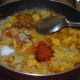 Step six: Add red chili powder, coriander powder, garam masala powder or spice powder, and salt. Mix well. Boil the mix for 2 minutes.