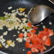 Step four: Throw in chopped tomatoes. Stir-cook until they become soft but not mushy.