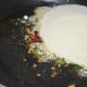 Step two: Add semolina. Stir-fry for 6 to 7 minutes on low heat.Transfer it to a plate.