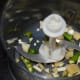 Finely chop or crush the ginger, garlic, and green chilies.