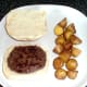 Burger and roast potatoes are plated