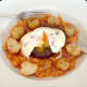 Cutting in to poached egg and buffalo and beef burger