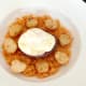 Crispy poached egg is laid on burger