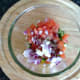 Salsa ingredients are combined in a bowl