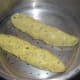 Steps 5 and 6: Divide the dough into two parts. Make cylindrical shapes of about an inch diameter. Steam-cook for 20 minutes.