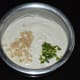 Step three: Collect it in a bowl. Add finely chopped ginger and green chilies. Beat the batter to aerate.