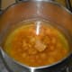 Step five: Add some water to the jaggery powder. Heat till it melts. Strain the mix. Collect the syrup in a bowl. Discard the impurities.