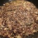 Stir in 1 cup warm chicken stock, reduce heat to medium.
