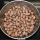 Step two: Strain the mix and collect the peanuts.