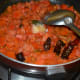 Step six: Add sugar and salt. Mix well. Cover the pan and cook while stirring occasionally. Add water if needed.