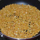 Step two: Roast gram dal/chana dal on a very low heat till they turn golden brown and give out nice aroma. Transfer it to a plate.