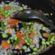Saute the mix for 4 minutes or till fresh peas become soft and tomatoes turn mushy.