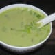 Pour it equally into three bowls. Garnish them with chopped spring onion greens. Enjoy sipping this hot, smoky-flavored soup.