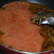 Step six: Pour tomato puree to the pan. Add salt. Stir-cook for 4 minutes.