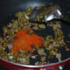 Step five: Add red chili powder, garam masala powder, cumin-coriander powder, and turmeric powder. Saute for 30 seconds.