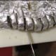 slice the roll with aluminum foil holding it