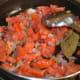 Step 6: Add tomatoes. Cook them until they get mashed.