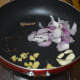 Step three: In the same pan, throw in chopped onions, ginger, garlic, pepper corns, cinnamon stick, cumin, and cloves. Saute till onions turn translucent. Collect them in a mixer or blender.