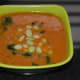 Step seven: Pour it equally into four bowls. Add some cooked beans to each bowl. Garnish with sauteed spinach. Now, your favorite bean tomato soup is ready! Serve it hot.