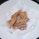 Deep fried sausages are left to drain