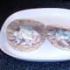 Horseradish sauce is spooned on to pickled mackerel