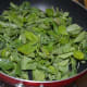 Step five: Add fenugreek leaves to the same pan. Saute till they wilt and get cooked. Collect them in a bowl.