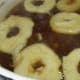 Put raised bagels in boiling sugar water.