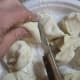 Use a sharp knife to cut the dough into 16 pieces.