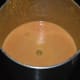 Step four: Grind to get a smooth liquid. Transfer it to a bowl. Add remaining yogurt and water. Mix well. Your favorite ginger-garlic drink is ready.