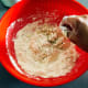Use your hands to combine the mixture. Knead until it forms a dough.