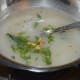 Step six: Add the fried garlic to the saucepan. Also add chopped coriander leaves. Your favorite lemon and rice soup is ready to indulge in!
